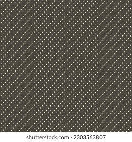 Oblique interrupted lines or stitches with white thread, applied on a black background. Dark surface with broken slanted stripes. Textile design. Simple decorative pattern.