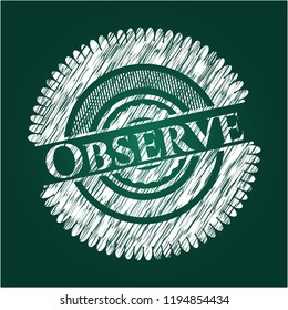 Observe chalkboard emblem written on a blackboard