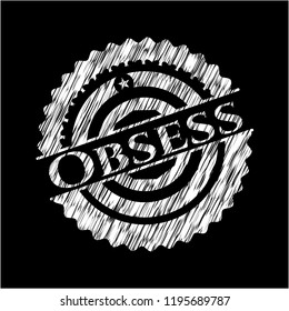 Obsess written on a chalkboard
