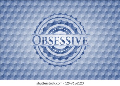 Obsessive blue badge with geometric pattern.