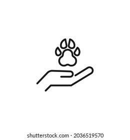 El concepto de ocupación y profesión. Símbolo de esquema de alta calidad para diseño web o aplicación móvil. Icono de línea de la pata del perro sobre la mano de un veterinario sin rostro 
