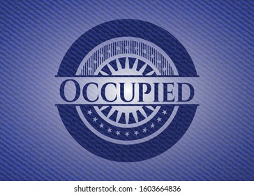 Occupied emblem with denim high quality background. Vector Illustration. Detailed.