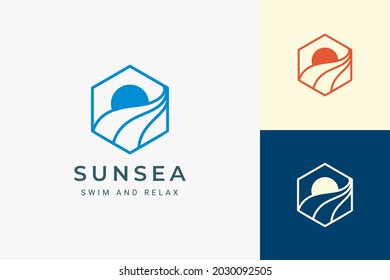 Ocean or beach hexagon logo with simple sun and wave shape