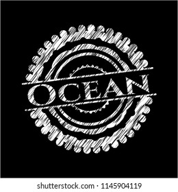 Ocean chalk emblem written on a blackboard