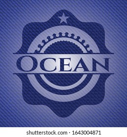 Ocean emblem with denim high quality background. Vector Illustration. Detailed.