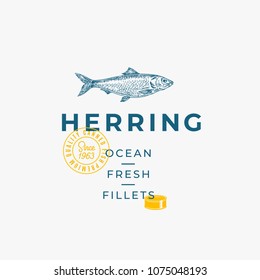 Ocean Fresh Fillets Abstract Vector Sign, Symbol or Logo Template. Hand Drawn Herring Fish with Premium Modern Typography, Quality Seal and Tin Can Silhouette. Stylish Vector Emblem Concept. Isolated.