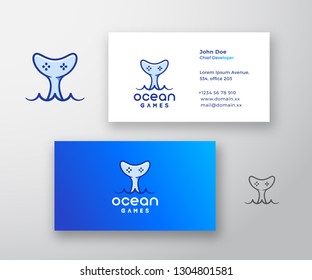 Ocean Games Abstract Vector Logo and Business Card Template. Gamepad Icon Incorporated in a Whale Tail. Premium Stationary Realistic Mock Up. Isolated.