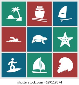Ocean icons set. set of 9 ocean filled icons such as turtle, cargo ship, sailboat, windsurfing, starfish, swimmer, island, surfing