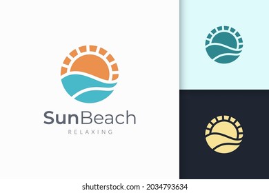 Ocean or sea logo in abstract water wave and sun represent adventure