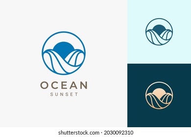 Ocean or water theme logo with waves and sun in circle