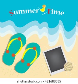 Ocean wave on a sandy beach with flip flops and photo frame and inscription Summer time