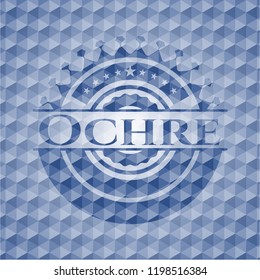 Ochre blue emblem with geometric background.