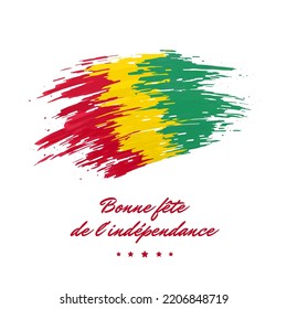 October 2, independence day guinea, vector template. Guinea flag painted with brush strokes on a light background. National holiday of october 2nd. Greeting card. Translation: Happy Independence Day