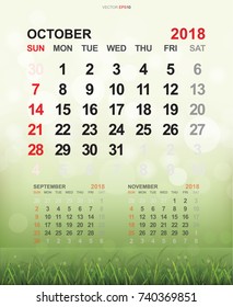 October 2018 - Monthly calendar template 2018 year in simple. Week starts from Sunday. With grass field and light blurred bokeh background. Vector illustration.