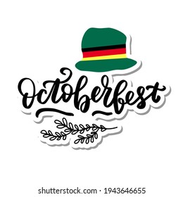 October fest sticker logo with green ha, ribbon German flag colors. Hand lettering brush calligraphy.  typography for Octoberfest holidays greeting card, invitation, banner, postcard, web, poster