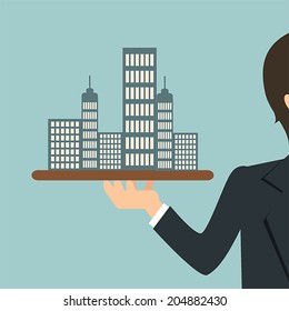 Offer of house concept (real estate). Businessman is having model of the real estate on tray
