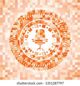 office chair icon inside abstract emblem, orange mosaic background