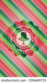 office chair icon inside christmas colors badge.