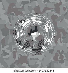 office chair icon inside grey camouflaged emblem