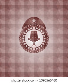 office chair icon inside red seamless badge with geometric background.