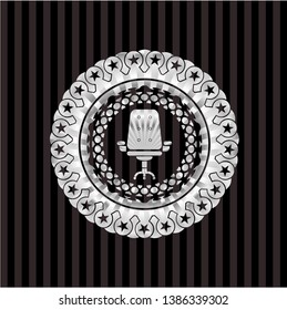 office chair icon inside silver shiny badge