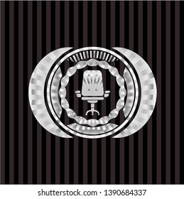 office chair icon inside silver shiny badge