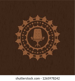 office chair icon inside wooden emblem