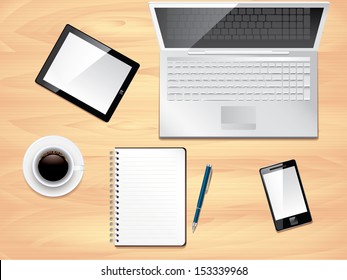 Office desk with laptop, notepad, tablet, smartphone and coffee cup top view background