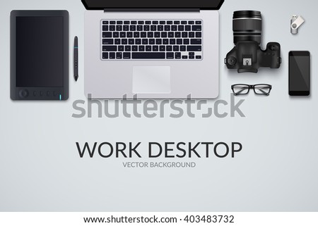 Office desk table with laptop, photo camera, glasses, graphic tablet, pen, phone and flash drive. Top view with copy space. Eps10 vector template.