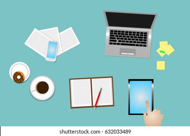 Office desk top view with supplies, coffee cup and donut. The hand is pointing finger on the empty tablet display.