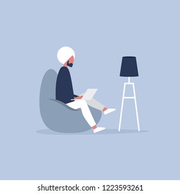 Office furniture. Young indian manager sitting on the bean bag chair. Daily life. Flat editable vector illustration, clip art