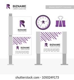 Office items clock , clip and cards with company slogan and R lo