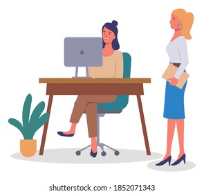 Office meeting and consideration of working affairs. Office workers women discussing project. Businesswomen dressed in formal clothes siting at the table with laptop, standing in room and talking