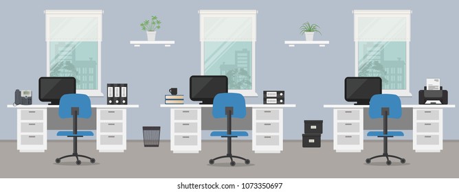 Office room in a blue color. Workplace of office workers with white furniture on a windows background. There are desks, blue chairs, computers, a phone, a printer and other objects in the picture. 