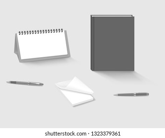 Office stationery on the table, vector template. Desk calendar, hardcover notebook, sticky note pad, ballpoint pens.