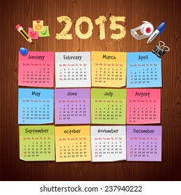 Office Stickers Calendar 2015 calendar on Wooden Background.