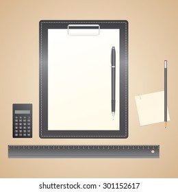 Office subjects. note, pen, calculator on a table