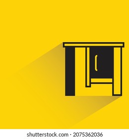 office table with shadown on yellow background