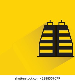 office tower with shadow on yellow background
