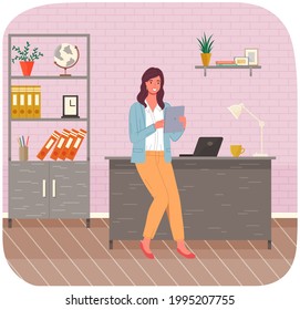 Office woman sits on table with tablet. Smiling businesswoman or clerk working in modern workspace. Girl office worker enterpreneur performs work on computer, resting during break surfing in internet