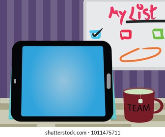 office work environment with tablet and whiteboard