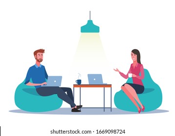 Office Worker Chatting While Sitting On Bean Bag Chairs