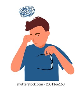 Office worker male holding glasses with headache symptom. Guy employee feel tired and fatigue from overload work. Problem at work.