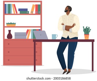 Office worker standing next to table with laptop. Businessman or clerk working at his office workplace. Smiling man enterpreneur resting during break in working day, thinking about something