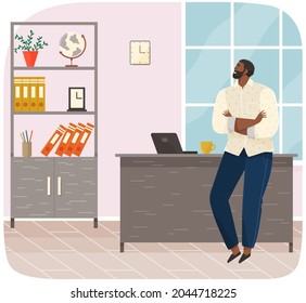 Office worker standing next to table with laptop. Businessman or clerk working at his office workplace. Smiling man enterpreneur resting during break in working day, thinking about something