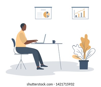 Office worker in the workplace. Young black man is sitting at the desk in the office room. There is a chair, a laptop, a cup, diagrams and a flower in the picture. Funky flat style. Vector