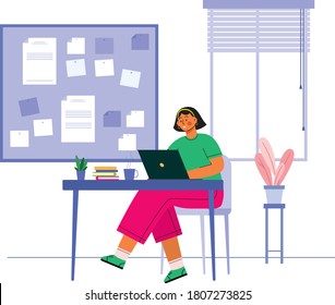 Office workers sitting at desks with laptop