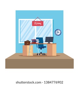 office workplace with hiring label hanging