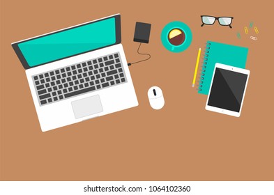 Office workplace on a brown background the top view