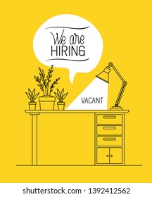 office workplace with we are hiring message